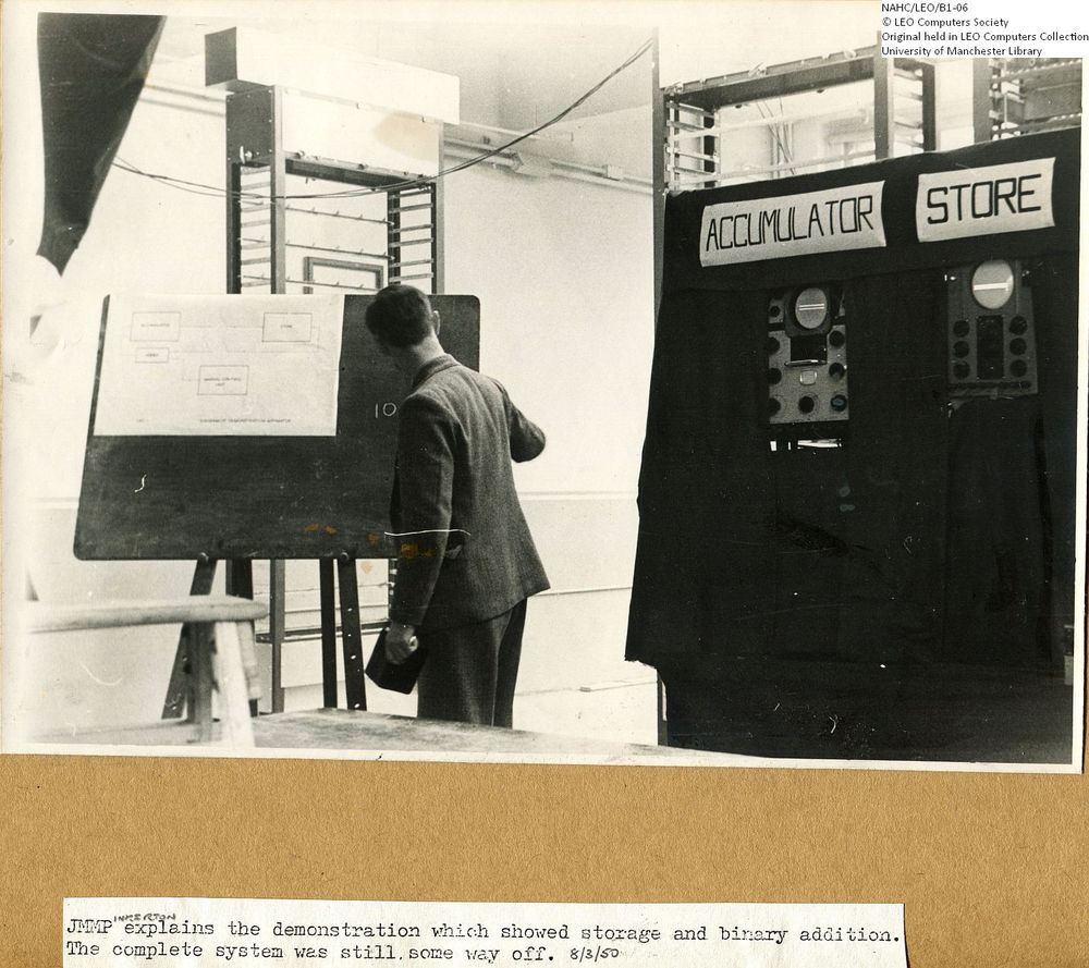 Photograph of 61850  John Pinkerton at the blackboard for the LEO I Demonstration  (1950)