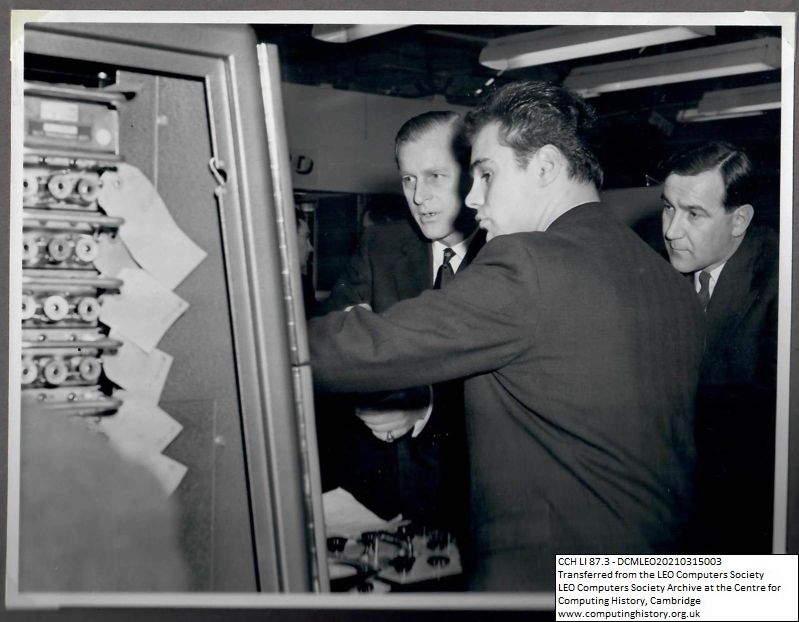 Photograph of 67806 Prince Philip examining a machine at Minerva Road