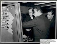 67806 Prince Philip examining a machine at Minerva Road
