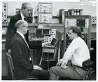 64070 Photo of Ernest Lenaerts, D.W. Boston and Michael Underwood with ICL speech recognizer