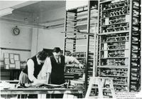 60761 Gordon Gibbs and Ray Shaw looking at a LEO I circuit diagram